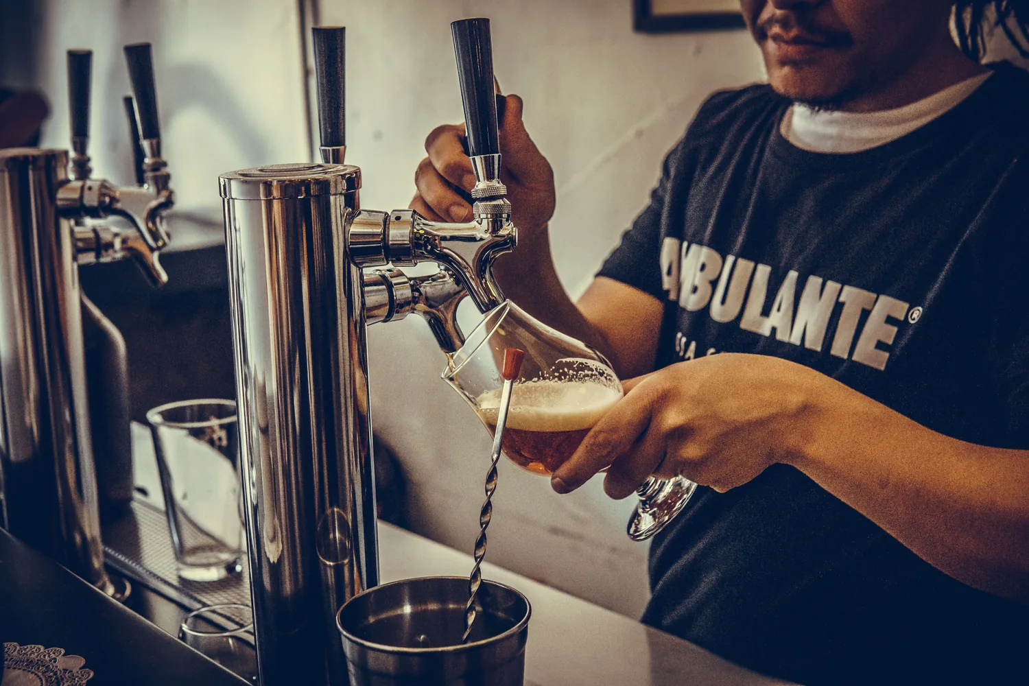 Beer taps at a brewery taproom bar
