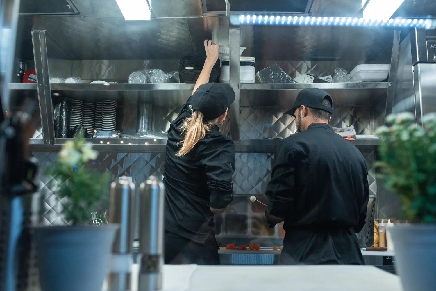 Line cooks working a busy restaurant kitchen