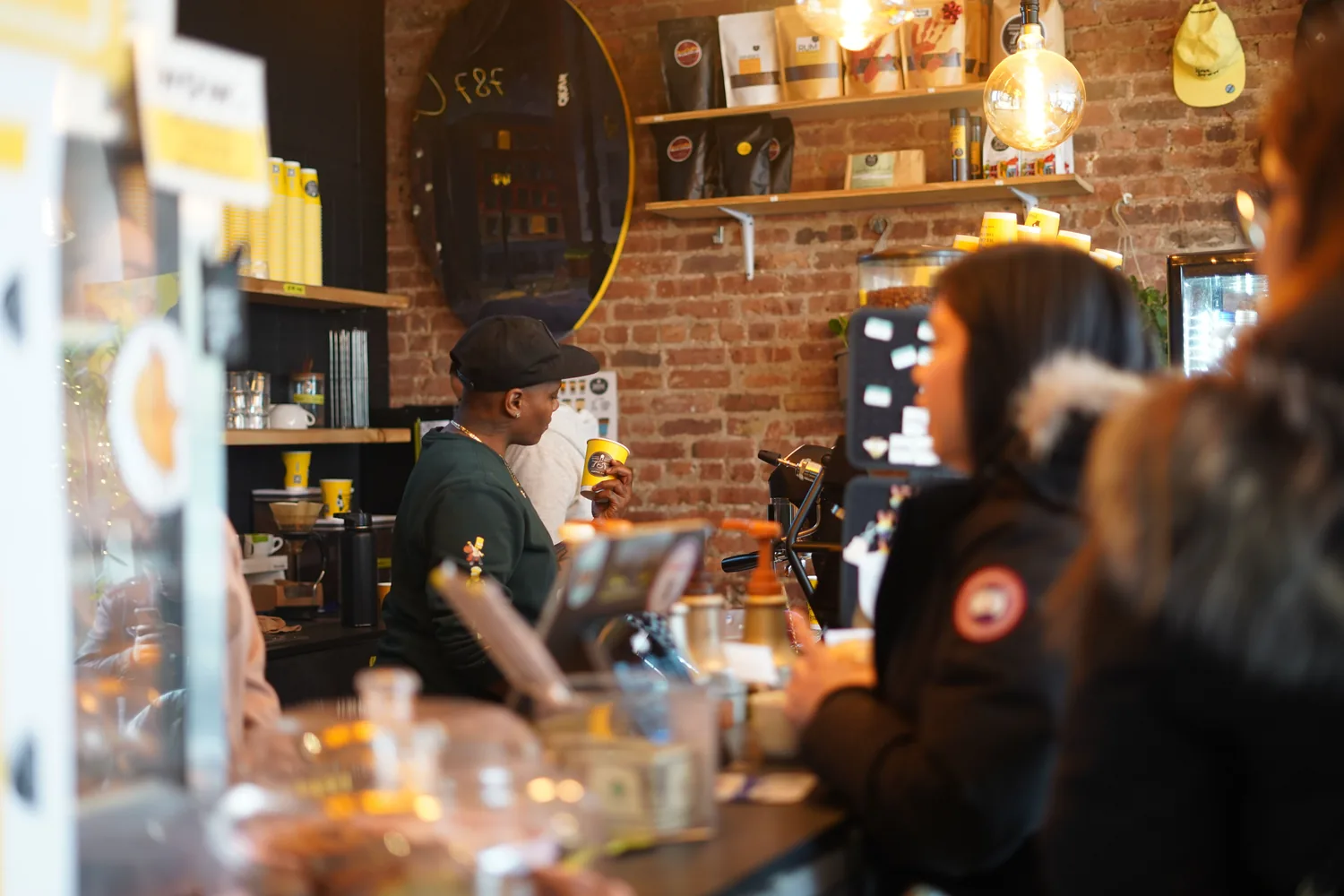 Customers queuing in a busy coffee shop