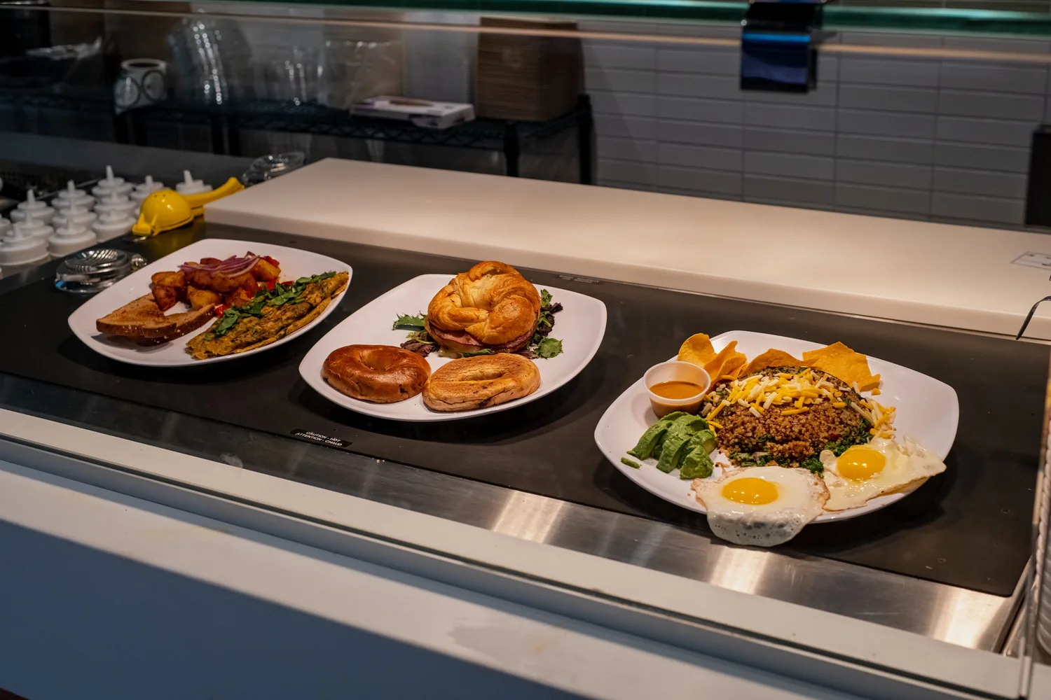 Breakfast plates being served at a diner