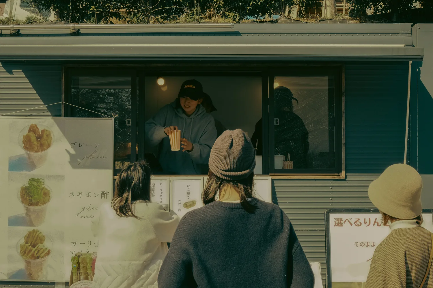 Customer being served at a food truck window