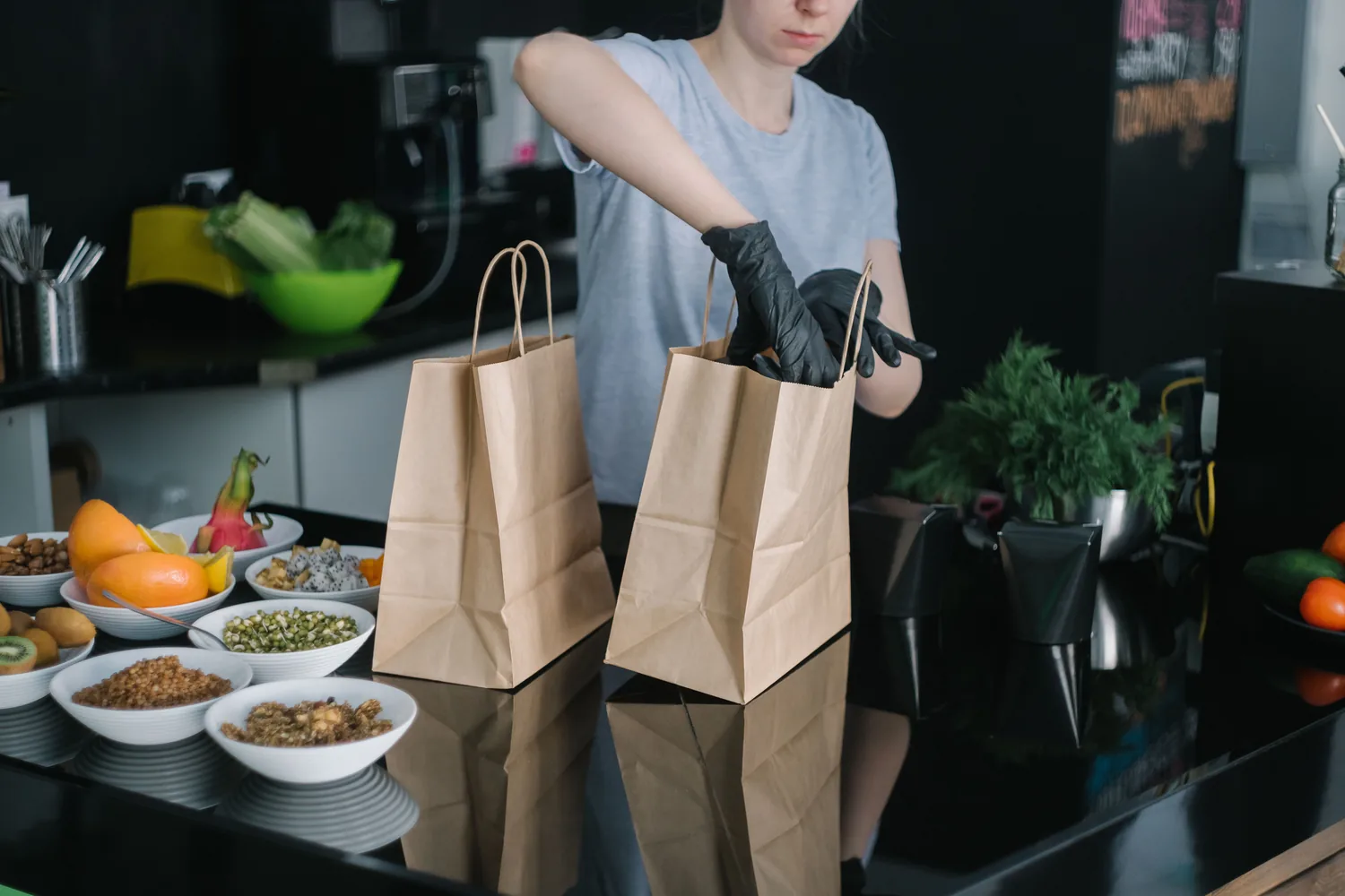 Takeout orders being packed in a delivery kitchen